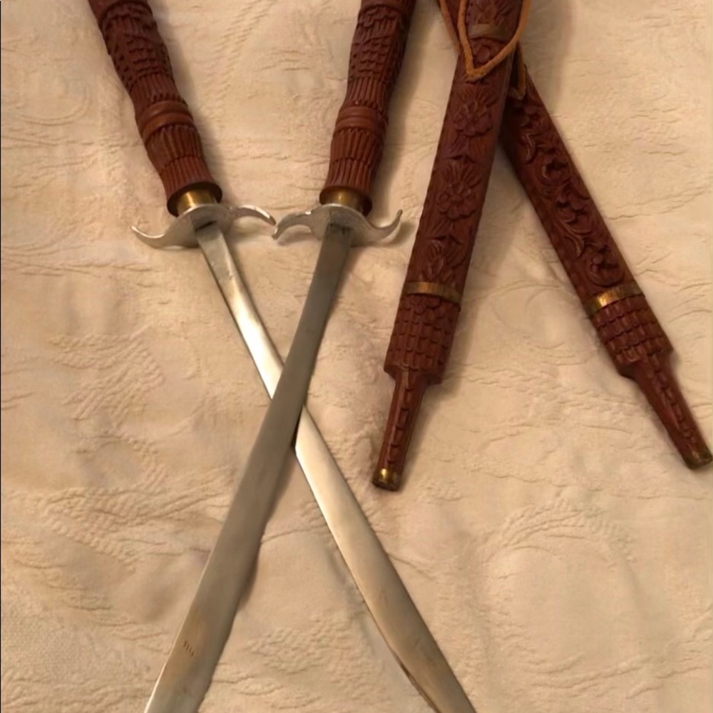 A pair of teakwood sheath swords